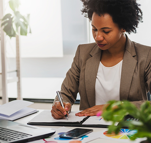 How & Why to Communicate During COVID-19 | Marketing | Blog | Everlytic | Woman working from home | Blog feature image