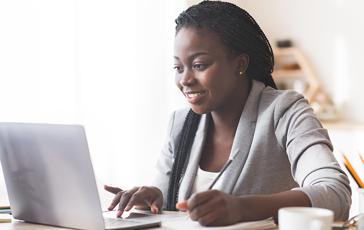 Use data to lead your email communications | Understanding How Customers Access Your Email Content | Everlytic blog | Blog image | Woman on laptop | African woman