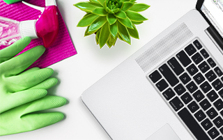 Four Steps to Spring Clean Your Contact Database | Everlytic | Email Marketing | Blog feature image | Laptop and cleaning gloves