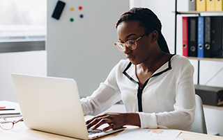 Everlytic POPIA Q&A: Who’s Responsible for POPIA & What will Happen if They Don’t Comply? | Woman on laptop | Feature image