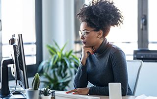 POPIA Q&A: Marketing to Certain People Without Extra Consent | Woman working on computer | Feature image
