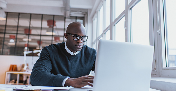 Launch Your Next Product or Service with the Sideways Sales Letter | Everlytic Blog Sideways Sales Letter Image 4 Everlytic Everlytic | Blog | Launch Your Next Product or Service with the Sideways Sales Letter | Blog Image | African Male Working on Laptop