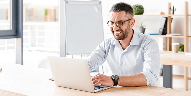 Everlytic-Blog-Email-List-Hygiene-Image-3 Clean Up Your Dirty Data with These 4 Email Database Hygiene Tips | Everlytic | Email marketing | Happy man working at laptop