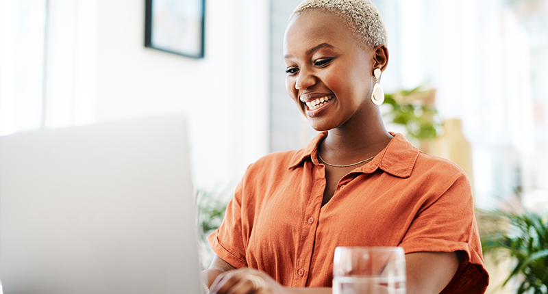 Effortlessly Boost Your Lead Generation with Landing Pages_Everlytic Blog_Feature Image_Woman Reading Off a Laptop